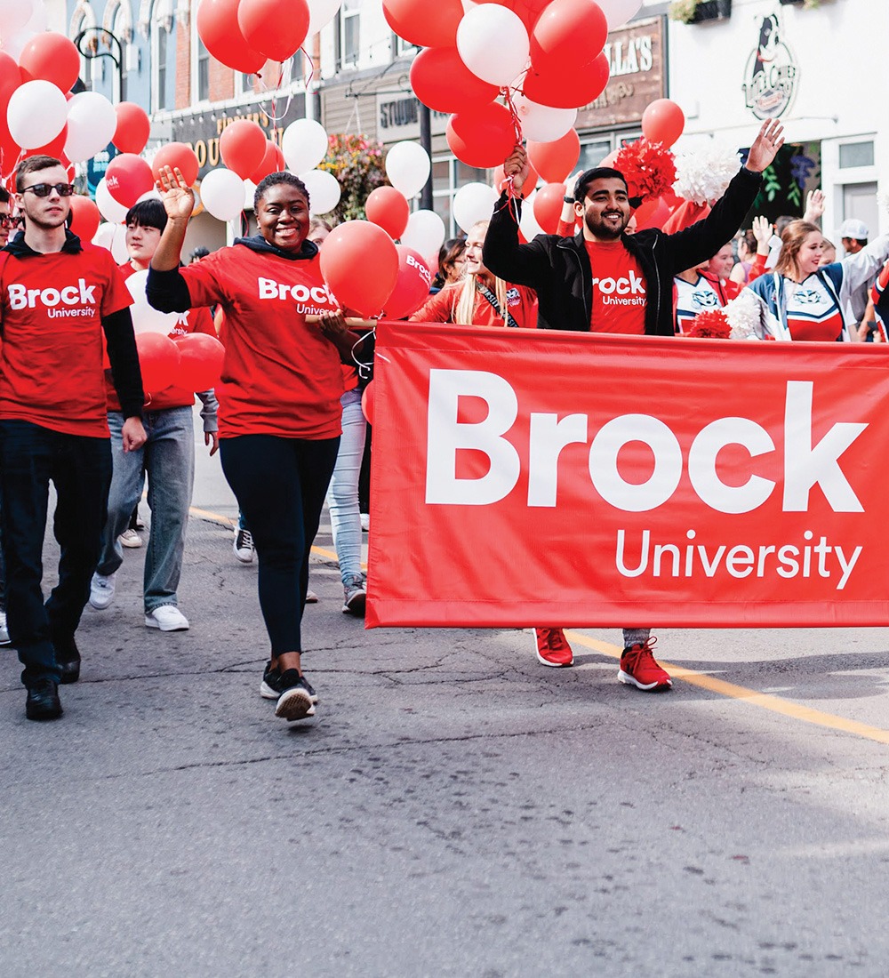 Brock University students walking in a parade 
