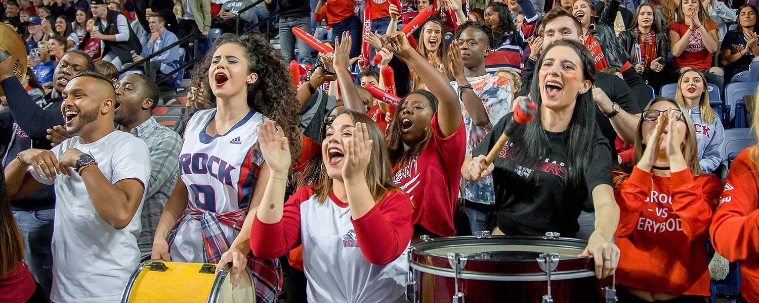 Brock students cheering at a Brock Badgers basketball game