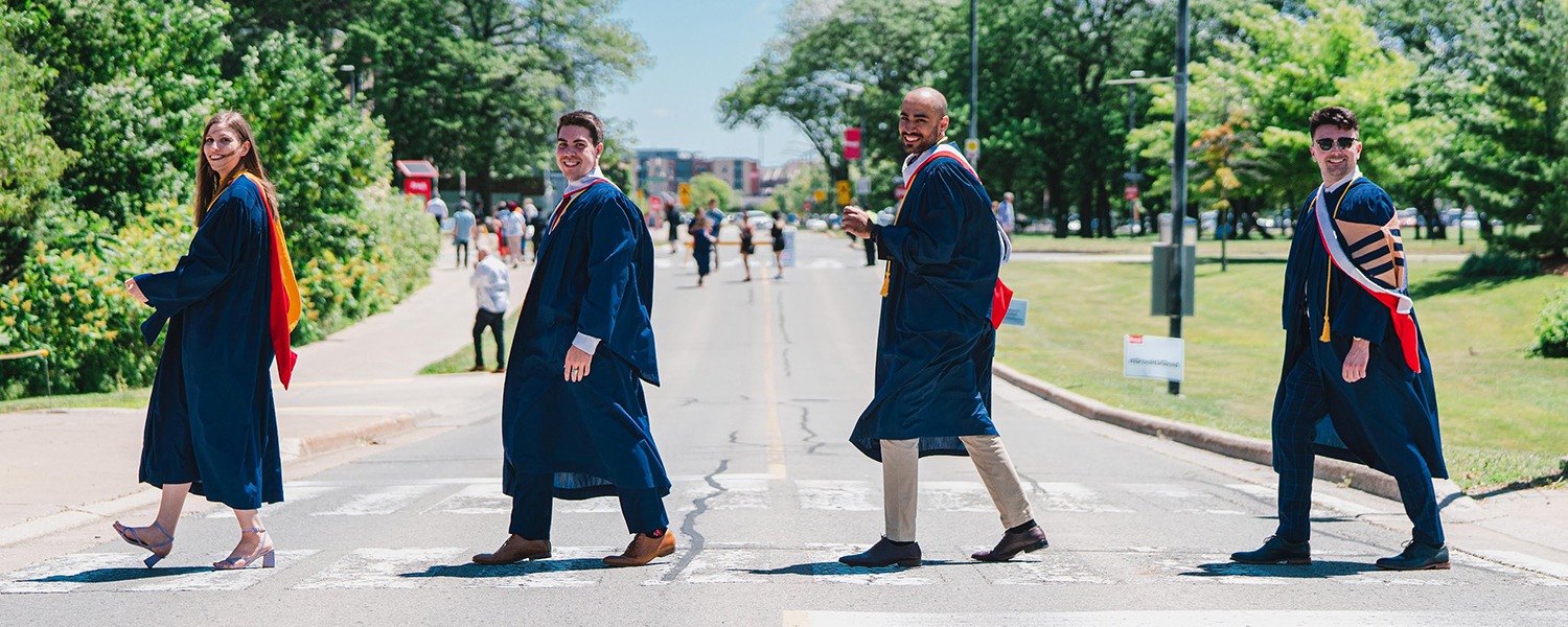 Brock graduates crossing the street at Convocation